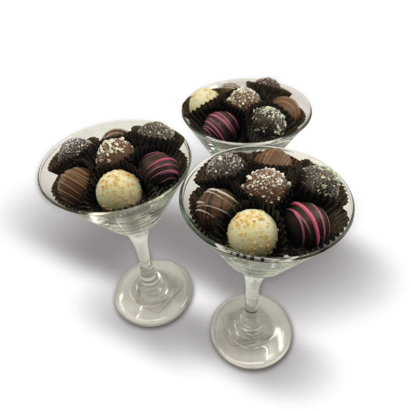 glass filled with assorted colorful truffles