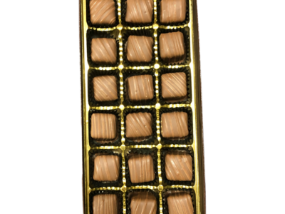 chocolate covered caramels in a gold box