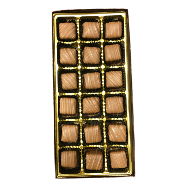 chocolate covered caramels in a gold box