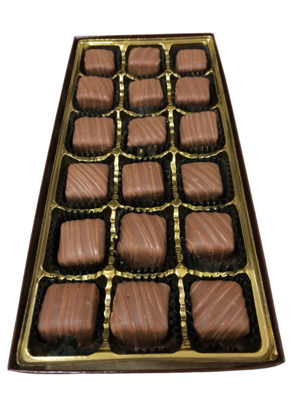 chocolate covered caramels in a gold box