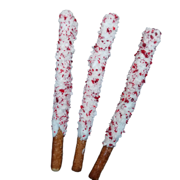 pretzel rods covered in white chocolate with peppermint crunch