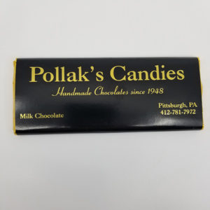 milk chocolate candy bar in black and gold wrapper