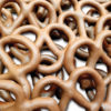 a pile of milk chocolate covered pretzels