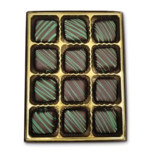 square chocolate pieces filled with smooth mint chocolate, striped with green chocolate