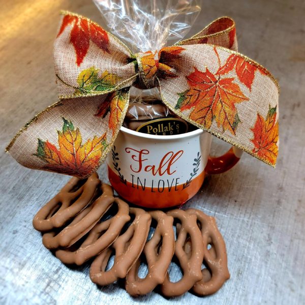 Mug saying Fall in Love filled with milk chocolate covered pretzels