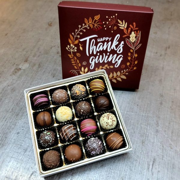 brown happy thanksgiving box filled with chocolate truffles