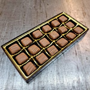 caramels in a box with gold insert