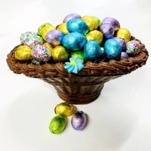chocolate basket filled with colorful chocolate eggs