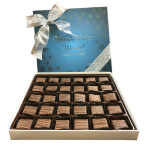 blue box with silver snowflakes filled with chocolate meltaways