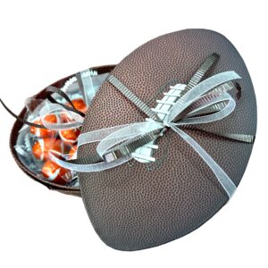 foootball shaped brown gift box with chocolate footballs